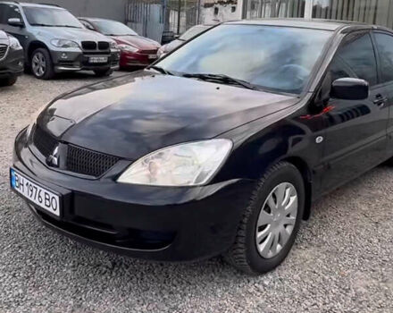 Чорний Міцубісі Lancer, об'ємом двигуна 1.58 л та пробігом 469 тис. км за 4600 $, фото 1 на Automoto.ua