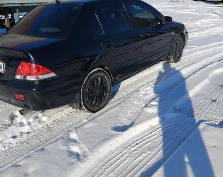 Черный Мицубиси Лансер, объемом двигателя 1.6 л и пробегом 180 тыс. км за 4400 $, фото 1 на Automoto.ua