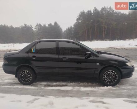 Чорний Міцубісі Lancer, об'ємом двигуна 1.6 л та пробігом 260 тис. км за 5500 $, фото 1 на Automoto.ua