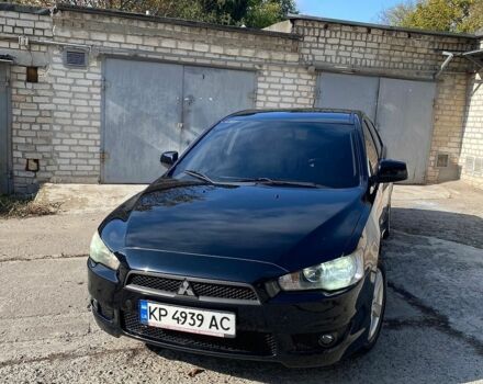 Черный Мицубиси Лансер, объемом двигателя 2 л и пробегом 150 тыс. км за 6500 $, фото 1 на Automoto.ua