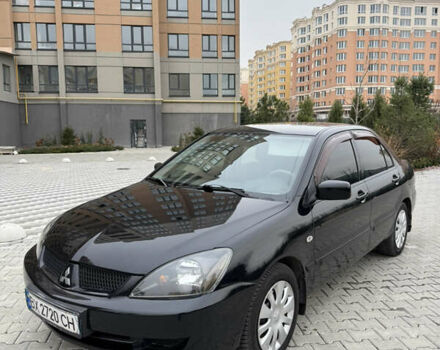 Черный Мицубиси Лансер, объемом двигателя 1.6 л и пробегом 240 тыс. км за 5200 $, фото 1 на Automoto.ua