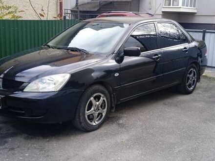 Чорний Міцубісі Lancer, об'ємом двигуна 1.58 л та пробігом 110 тис. км за 4900 $, фото 1 на Automoto.ua