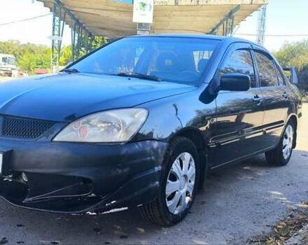 Чорний Міцубісі Lancer, об'ємом двигуна 1.58 л та пробігом 388 тис. км за 3000 $, фото 1 на Automoto.ua