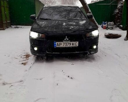 Черный Мицубиси Лансер, объемом двигателя 2 л и пробегом 21 тыс. км за 7300 $, фото 1 на Automoto.ua
