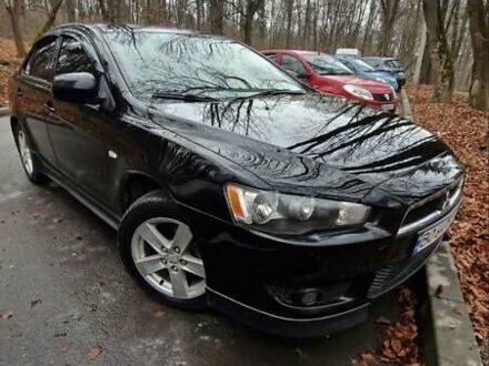 Черный Мицубиси Лансер, объемом двигателя 2 л и пробегом 302 тыс. км за 7200 $, фото 1 на Automoto.ua