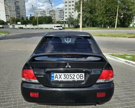 Чорний Міцубісі Lancer, об'ємом двигуна 1.58 л та пробігом 223 тис. км за 3000 $, фото 1 на Automoto.ua