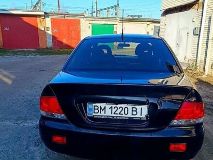 Черный Мицубиси Лансер, объемом двигателя 1.6 л и пробегом 230 тыс. км за 4700 $, фото 1 на Automoto.ua