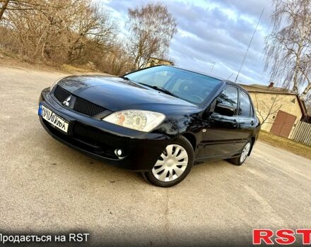Черный Мицубиси Лансер, объемом двигателя 1.6 л и пробегом 296 тыс. км за 4990 $, фото 1 на Automoto.ua