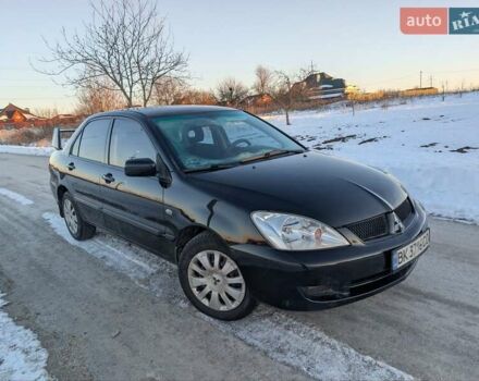 Черный Мицубиси Лансер, объемом двигателя 1.6 л и пробегом 330 тыс. км за 3350 $, фото 1 на Automoto.ua