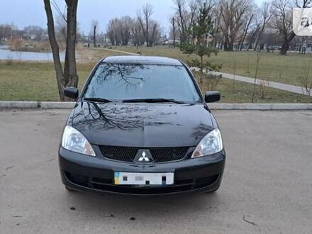 Чорний Міцубісі Lancer, об'ємом двигуна 1.6 л та пробігом 131 тис. км за 6000 $, фото 1 на Automoto.ua