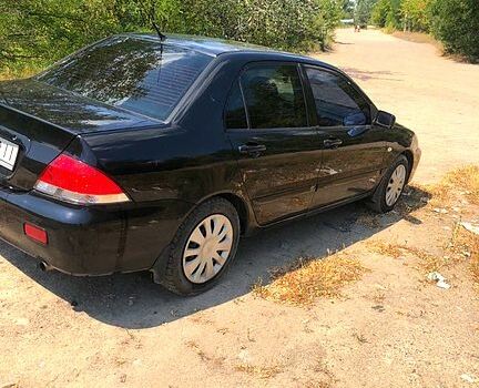 Чорний Міцубісі Lancer, об'ємом двигуна 1.6 л та пробігом 245 тис. км за 3200 $, фото 1 на Automoto.ua