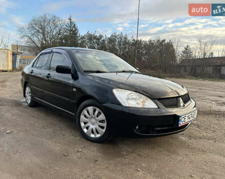 Черный Мицубиси Лансер, объемом двигателя 1.58 л и пробегом 312 тыс. км за 4900 $, фото 1 на Automoto.ua