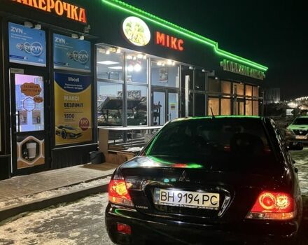 Черный Мицубиси Лансер, объемом двигателя 1.6 л и пробегом 200 тыс. км за 5600 $, фото 1 на Automoto.ua