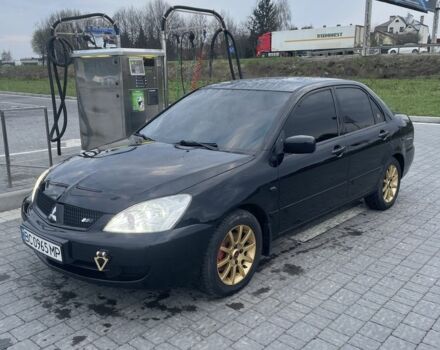 Черный Мицубиси Лансер, объемом двигателя 1.6 л и пробегом 200 тыс. км за 5000 $, фото 1 на Automoto.ua