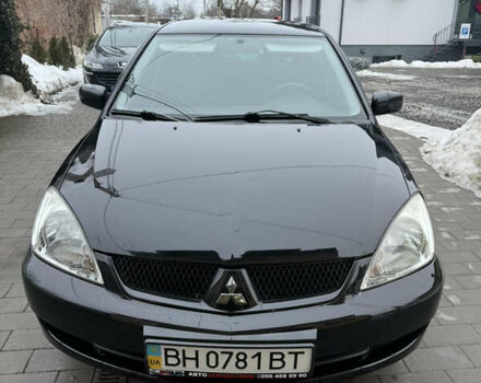Черный Мицубиси Лансер, объемом двигателя 1.6 л и пробегом 88 тыс. км за 5950 $, фото 1 на Automoto.ua