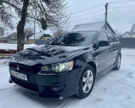 Черный Мицубиси Лансер, объемом двигателя 2 л и пробегом 180 тыс. км за 6999 $, фото 1 на Automoto.ua
