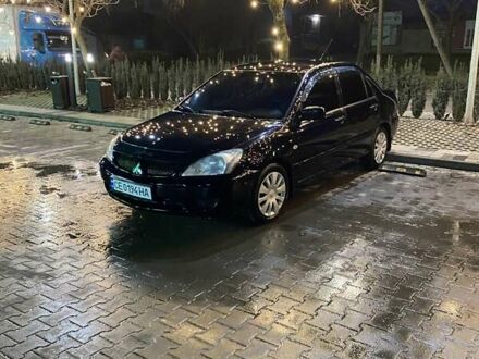 Чорний Міцубісі Lancer, об'ємом двигуна 1.58 л та пробігом 285 тис. км за 5100 $, фото 1 на Automoto.ua