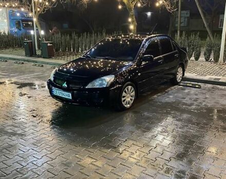 Черный Мицубиси Лансер, объемом двигателя 1.58 л и пробегом 285 тыс. км за 5100 $, фото 1 на Automoto.ua