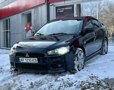 Черный Мицубиси Лансер, объемом двигателя 2 л и пробегом 237 тыс. км за 6500 $, фото 1 на Automoto.ua