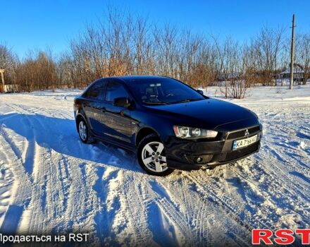 Черный Мицубиси Лансер, объемом двигателя 2 л и пробегом 35000 тыс. км за 6500 $, фото 1 на Automoto.ua