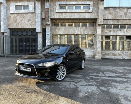 Черный Мицубиси Лансер, объемом двигателя 2 л и пробегом 236 тыс. км за 6550 $, фото 1 на Automoto.ua