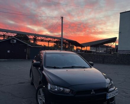 Черный Мицубиси Лансер, объемом двигателя 2 л и пробегом 270 тыс. км за 5600 $, фото 1 на Automoto.ua