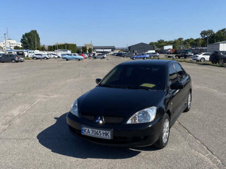 Чорний Міцубісі Lancer, об'ємом двигуна 1.58 л та пробігом 325 тис. км за 4300 $, фото 1 на Automoto.ua