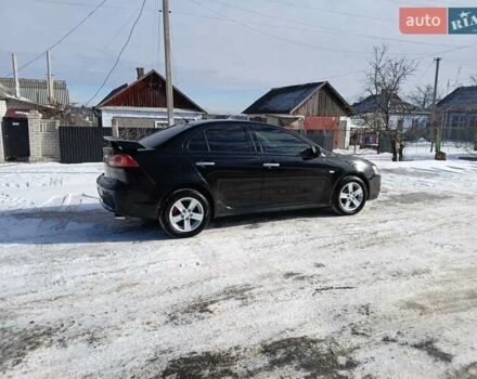 Черный Мицубиси Лансер, объемом двигателя 2 л и пробегом 240 тыс. км за 5900 $, фото 1 на Automoto.ua