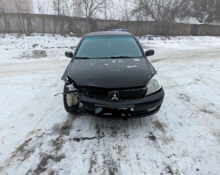 Черный Мицубиси Лансер, объемом двигателя 1.6 л и пробегом 274 тыс. км за 2000 $, фото 1 на Automoto.ua