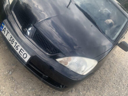 Чорний Міцубісі Lancer, об'ємом двигуна 1.58 л та пробігом 251 тис. км за 4400 $, фото 1 на Automoto.ua