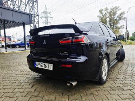 Черный Мицубиси Лансер, объемом двигателя 2 л и пробегом 240 тыс. км за 7450 $, фото 1 на Automoto.ua