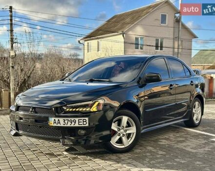 Черный Мицубиси Лансер, объемом двигателя 2 л и пробегом 150 тыс. км за 7850 $, фото 1 на Automoto.ua