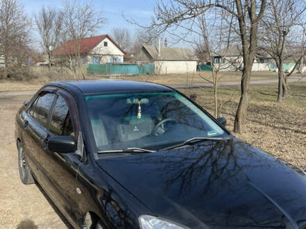 Мицубиси Лансер 2008 в Конотопе на Automoto.ua Черный Мицубиси Лансер, объемом двигателя 1.6 л и пробегом 256 тыс. км за 3699 $, фото 1 на Automoto.ua