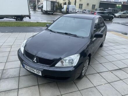 Черный Мицубиси Лансер, объемом двигателя 1.6 л и пробегом 226 тыс. км за 3750 $, фото 1 на Automoto.ua