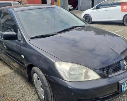 Чорний Міцубісі Lancer, об'ємом двигуна 1.58 л та пробігом 316 тис. км за 2200 $, фото 1 на Automoto.ua