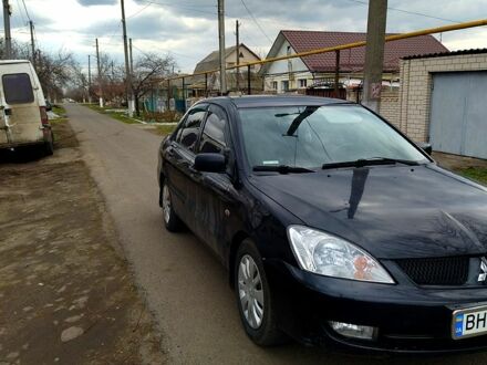 Мицубиси Лансер 2008 в Подольск (Котовск) на Automoto.ua Черный Мицубиси Лансер, объемом двигателя 16 л и пробегом 230 тыс. км за 3500 $, фото 1 на Automoto.ua