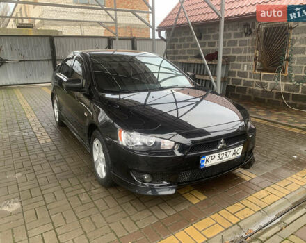 Черный Мицубиси Лансер, объемом двигателя 2 л и пробегом 64 тыс. км за 10200 $, фото 1 на Automoto.ua