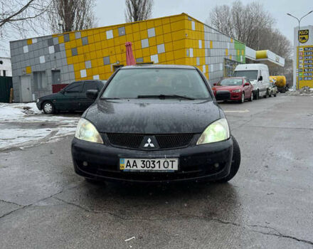 Черный Мицубиси Лансер, объемом двигателя 1.58 л и пробегом 333 тыс. км за 3900 $, фото 1 на Automoto.ua
