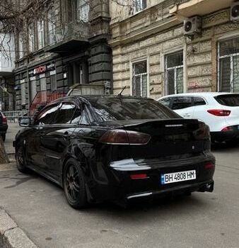 Черный Мицубиси Лансер, объемом двигателя 2 л и пробегом 200 тыс. км за 7500 $, фото 1 на Automoto.ua