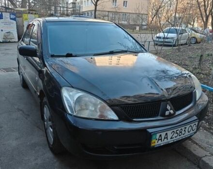 Черный Мицубиси Лансер, объемом двигателя 1.6 л и пробегом 192 тыс. км за 5000 $, фото 1 на Automoto.ua