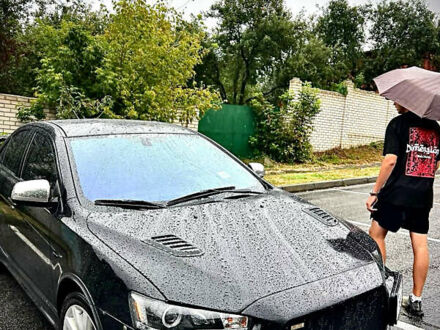 Чорний Міцубісі Lancer, об'ємом двигуна 2 л та пробігом 223 тис. км за 7800 $, фото 1 на Automoto.ua