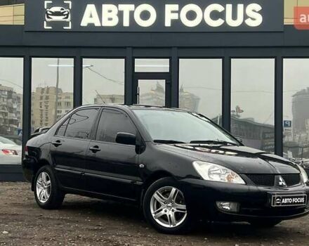 Черный Мицубиси Лансер, объемом двигателя 1.6 л и пробегом 340 тыс. км за 6190 $, фото 1 на Automoto.ua