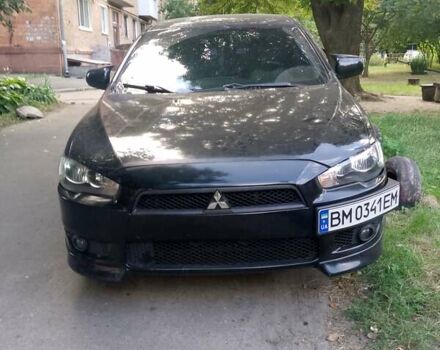 Черный Мицубиси Лансер, объемом двигателя 2 л и пробегом 180 тыс. км за 5800 $, фото 1 на Automoto.ua