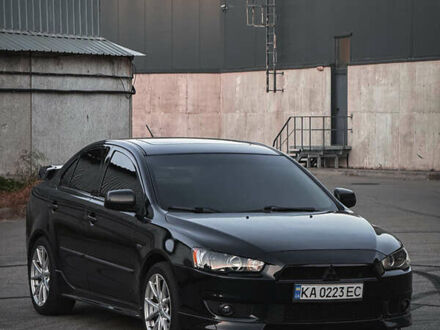 Чорний Міцубісі Lancer, об'ємом двигуна 2 л та пробігом 117 тис. км за 7000 $, фото 1 на Automoto.ua