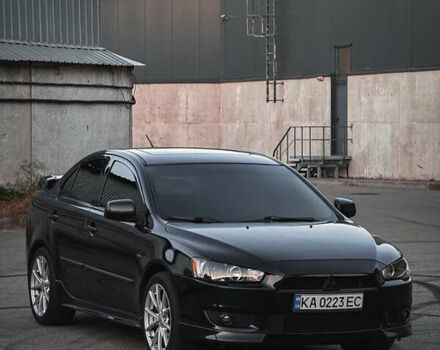 Чорний Міцубісі Lancer, об'ємом двигуна 2 л та пробігом 117 тис. км за 7000 $, фото 1 на Automoto.ua