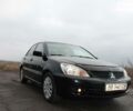 Чорний Міцубісі Lancer, об'ємом двигуна 1.6 л та пробігом 140 тис. км за 6550 $, фото 1 на Automoto.ua