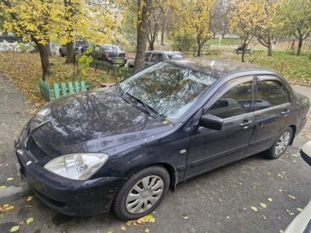 Черный Мицубиси Лансер, объемом двигателя 1.6 л и пробегом 243 тыс. км за 2900 $, фото 1 на Automoto.ua