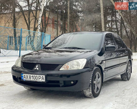 Черный Мицубиси Лансер, объемом двигателя 1.6 л и пробегом 220 тыс. км за 5500 $, фото 1 на Automoto.ua