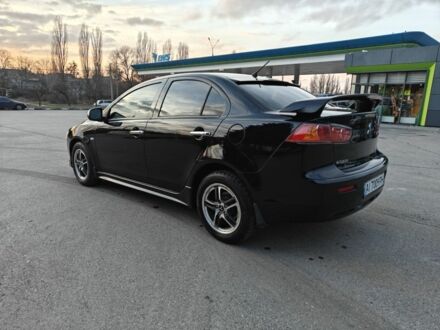 Черный Мицубиси Лансер, объемом двигателя 2 л и пробегом 245 тыс. км за 5600 $, фото 1 на Automoto.ua