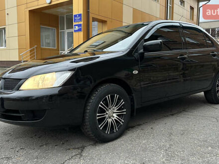 Черный Мицубиси Лансер, объемом двигателя 1.58 л и пробегом 167 тыс. км за 4800 $, фото 1 на Automoto.ua